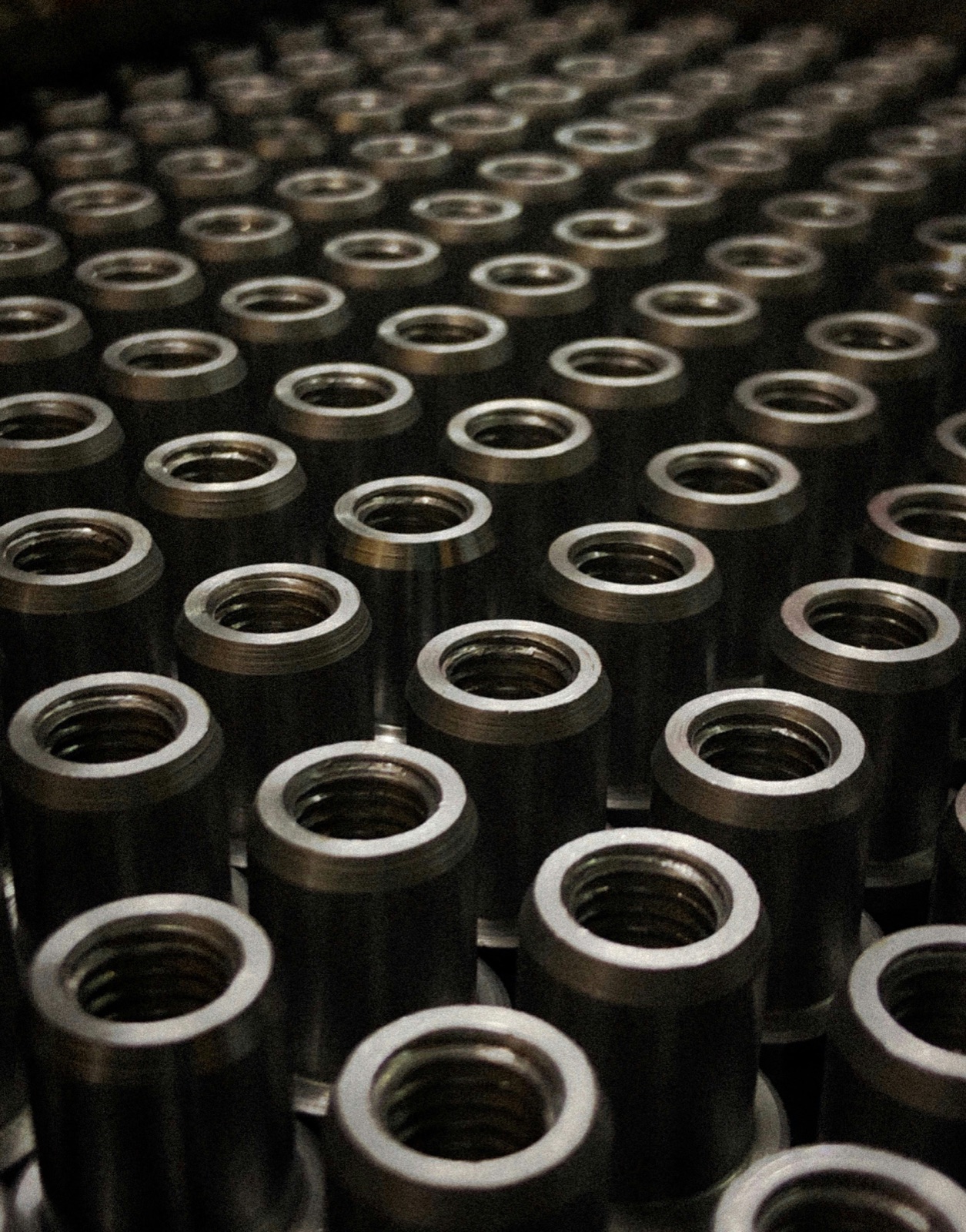 Rows of machined threaded metal couplings for Epo-Weld™ UHTE ultra high temperature epoxy dissimilar material bonding
