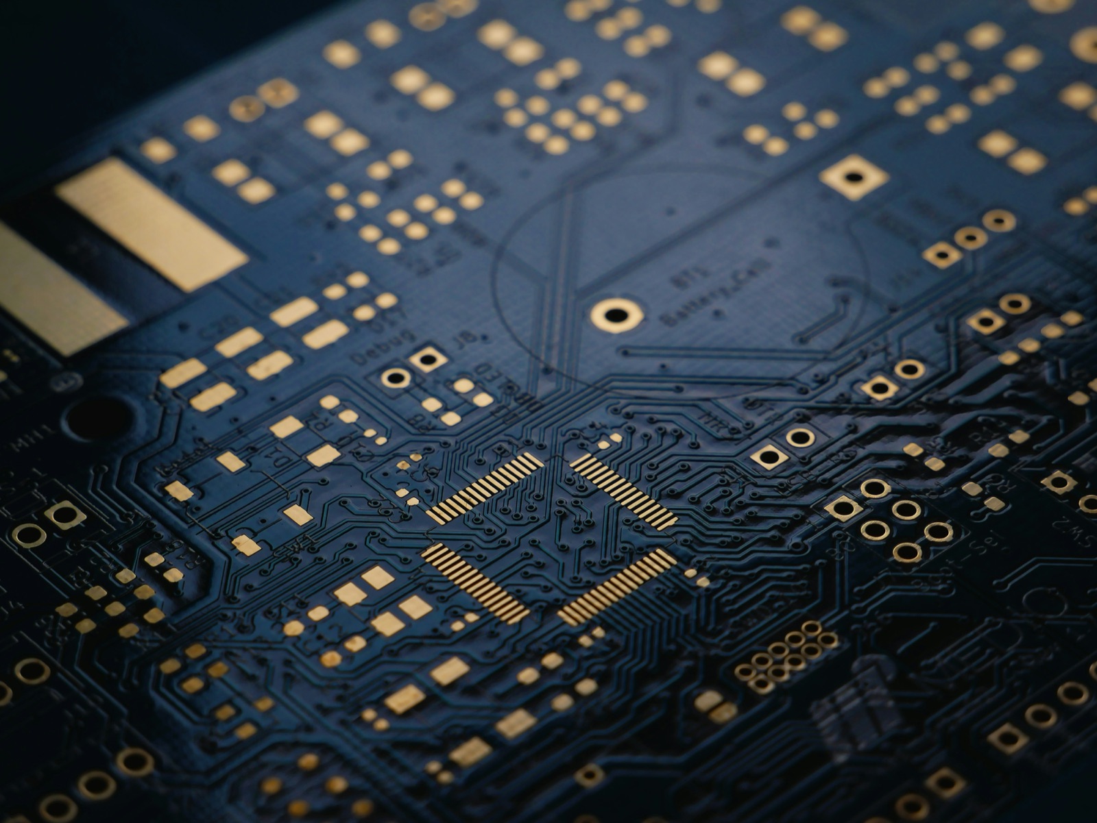 Dark navy PCB with gold ENIG traces for Pyra-Sil™ peelable silicone conformal coating masking
