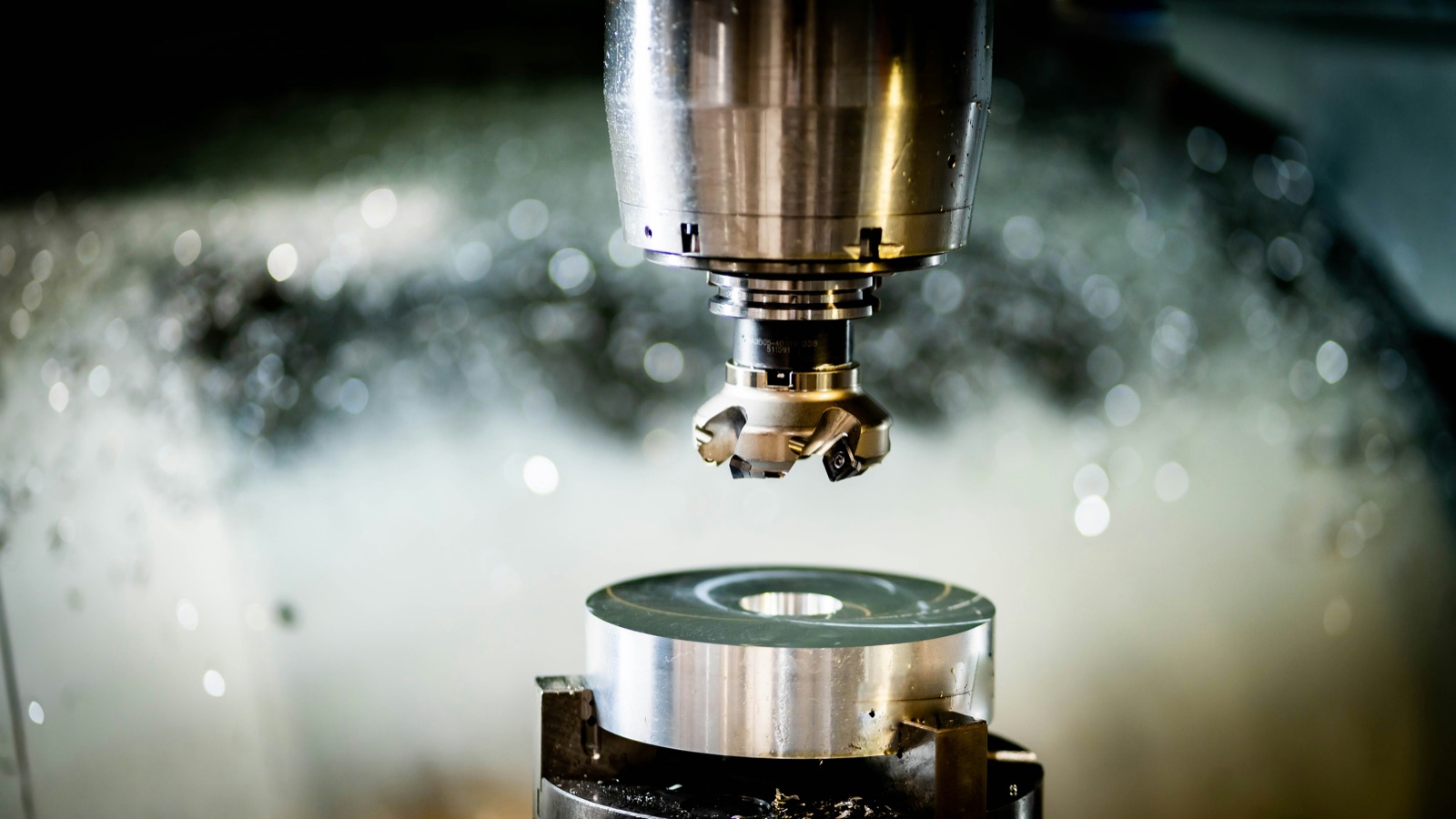 CNC milling machine precision machining a metal component for Pyra-Sil™ peelable silicone masking during